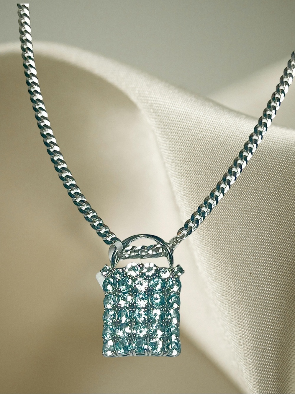 NWT Sterling Silver Rectangular Blue Topaz Pendant on a 20” Sterling Chain.